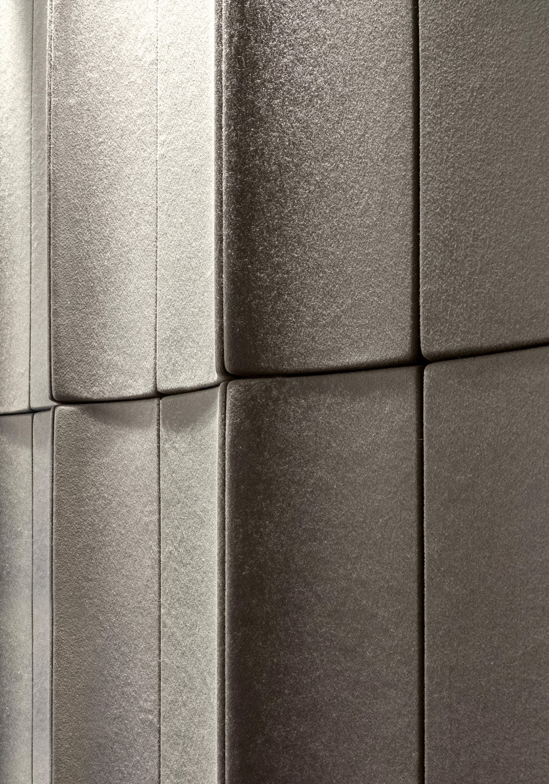 Close-up of Flux acoustic wall panels in the Akra Hotel ballroom showing the textured PET felt surface