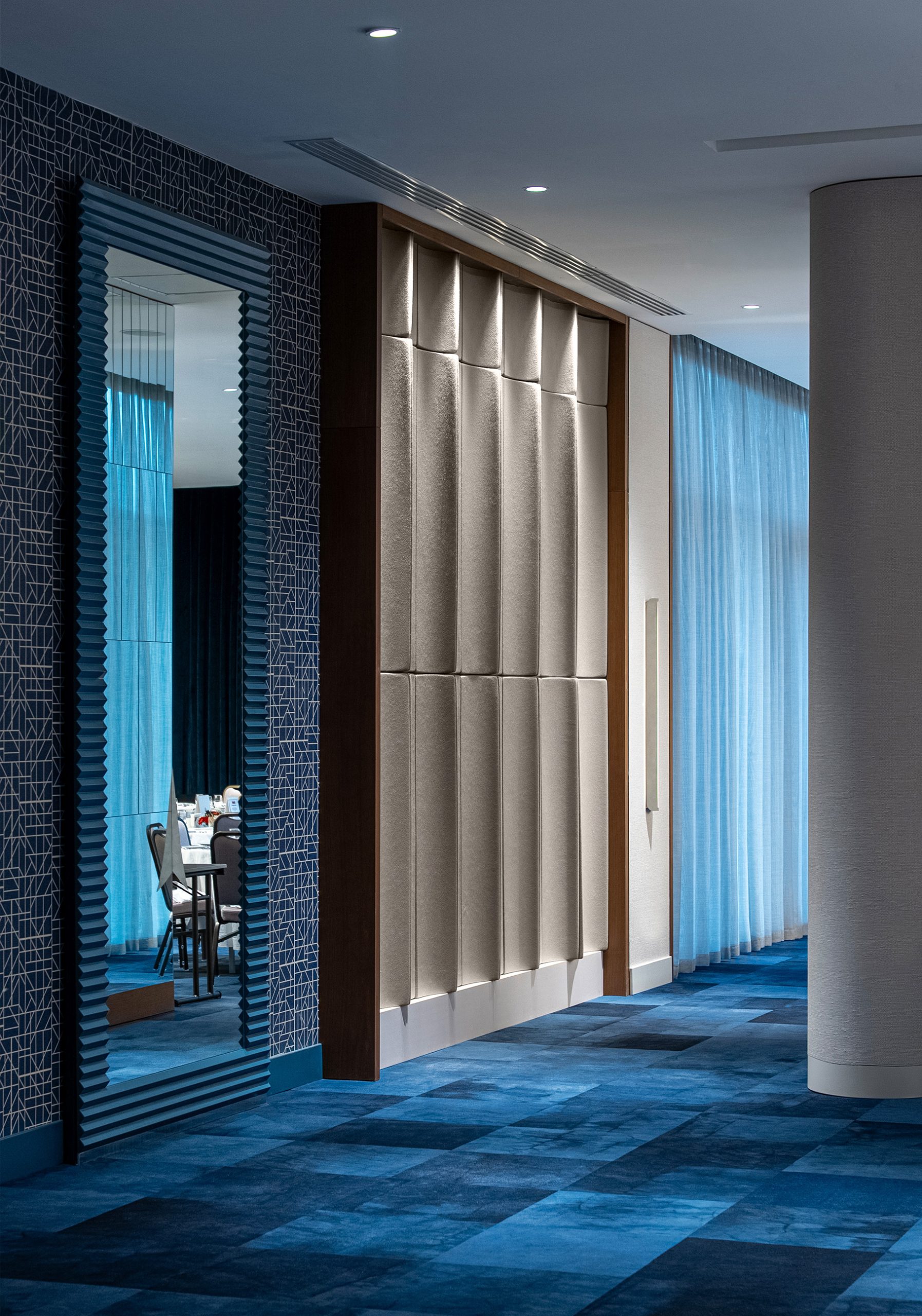 Flux acoustic wall panels installed in the Akra Hotel ballroom corridor to reduce reverberation and improve speech clarity