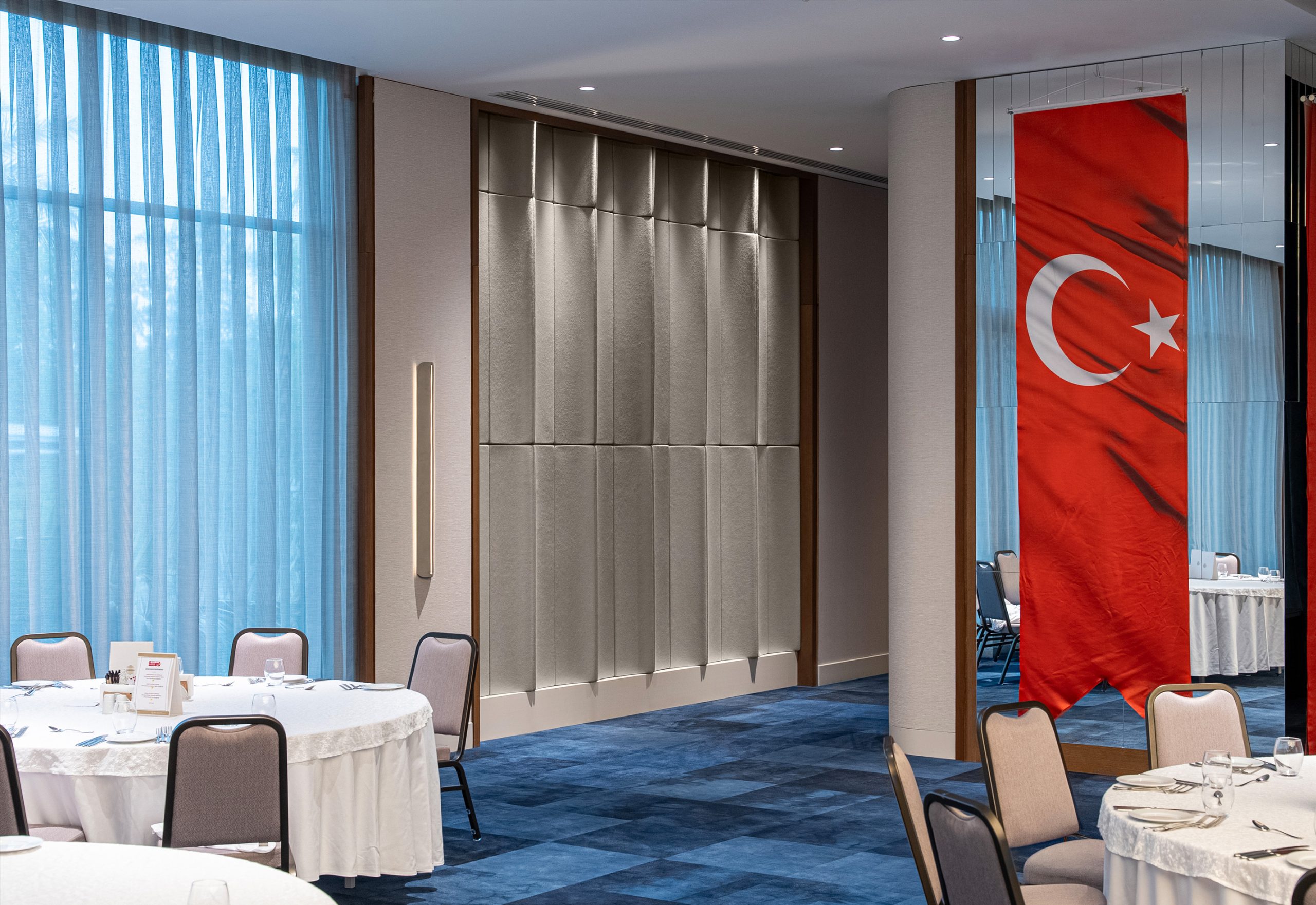 Flux acoustic wall panels installed along the ballroom walls at Akra Hotel for improved acoustics and speech clarity