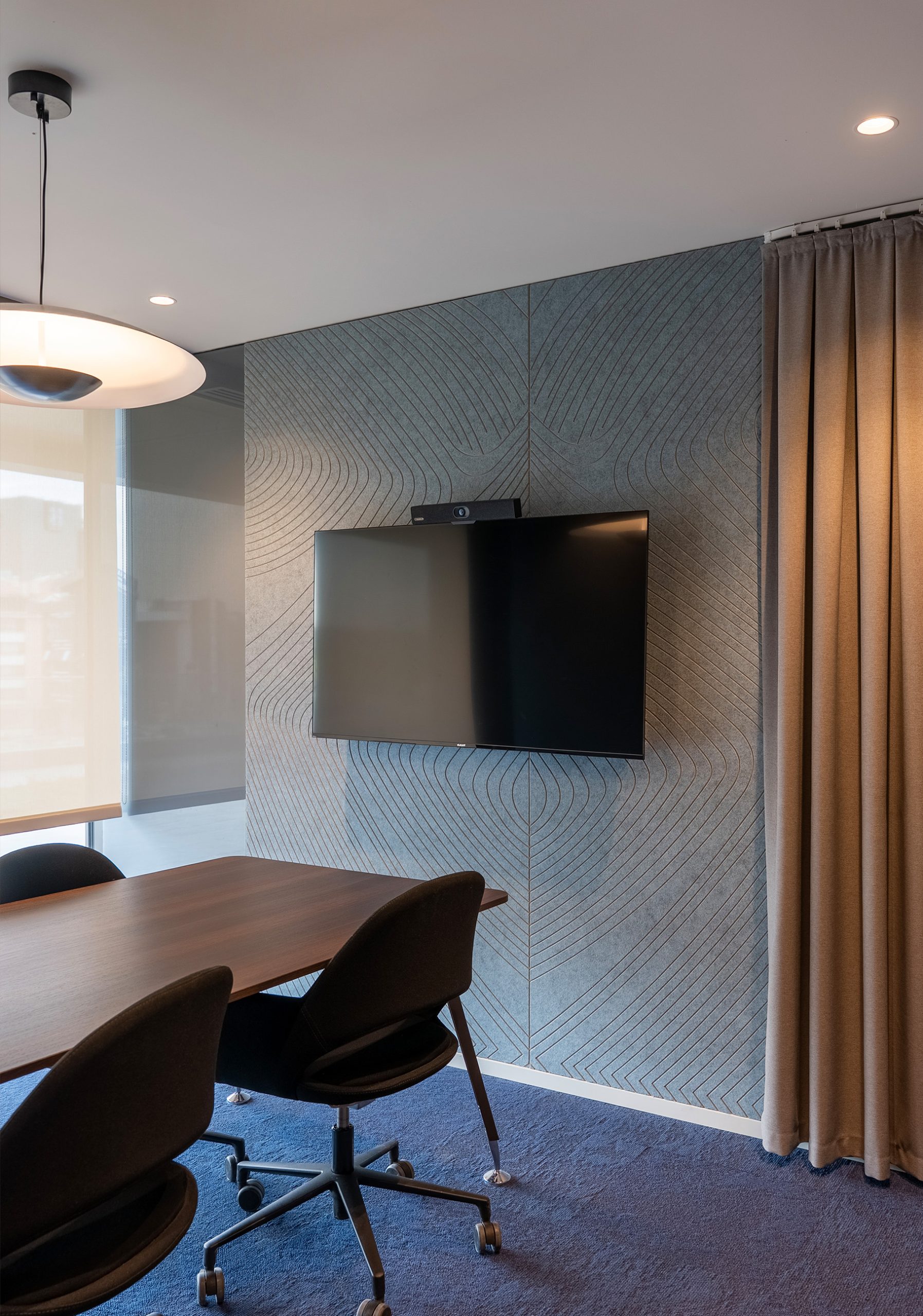 Tiles Zebra acoustic wall panel in a modern office meeting room