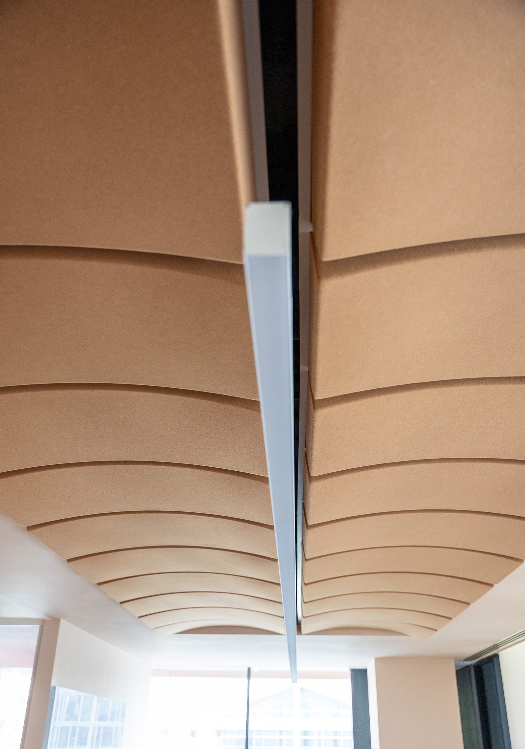 Volta acoustic ceiling panels with curved design