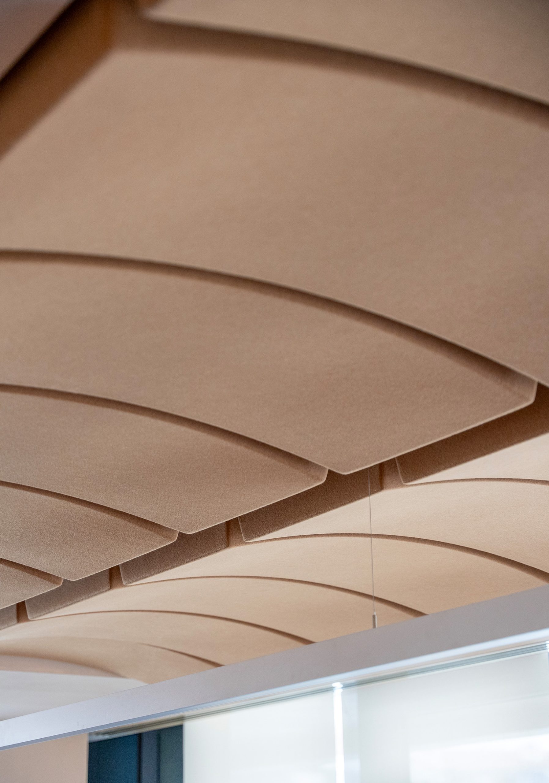 Volta acoustic ceiling panels with curved design