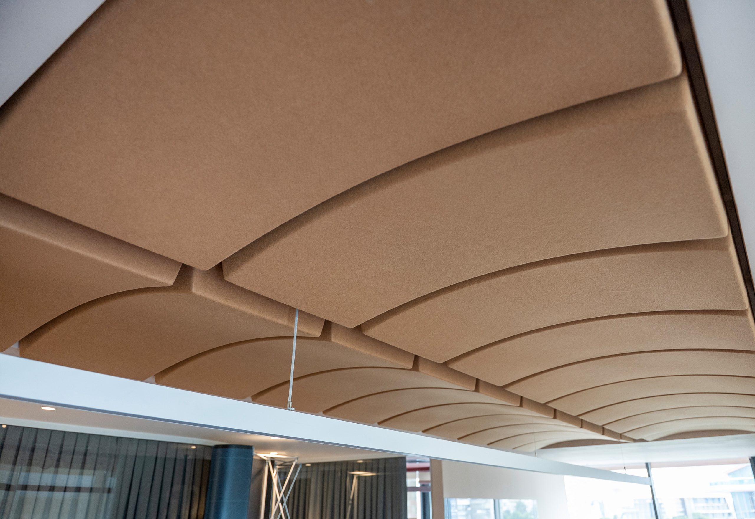 Volta acoustic ceiling panels with curved design