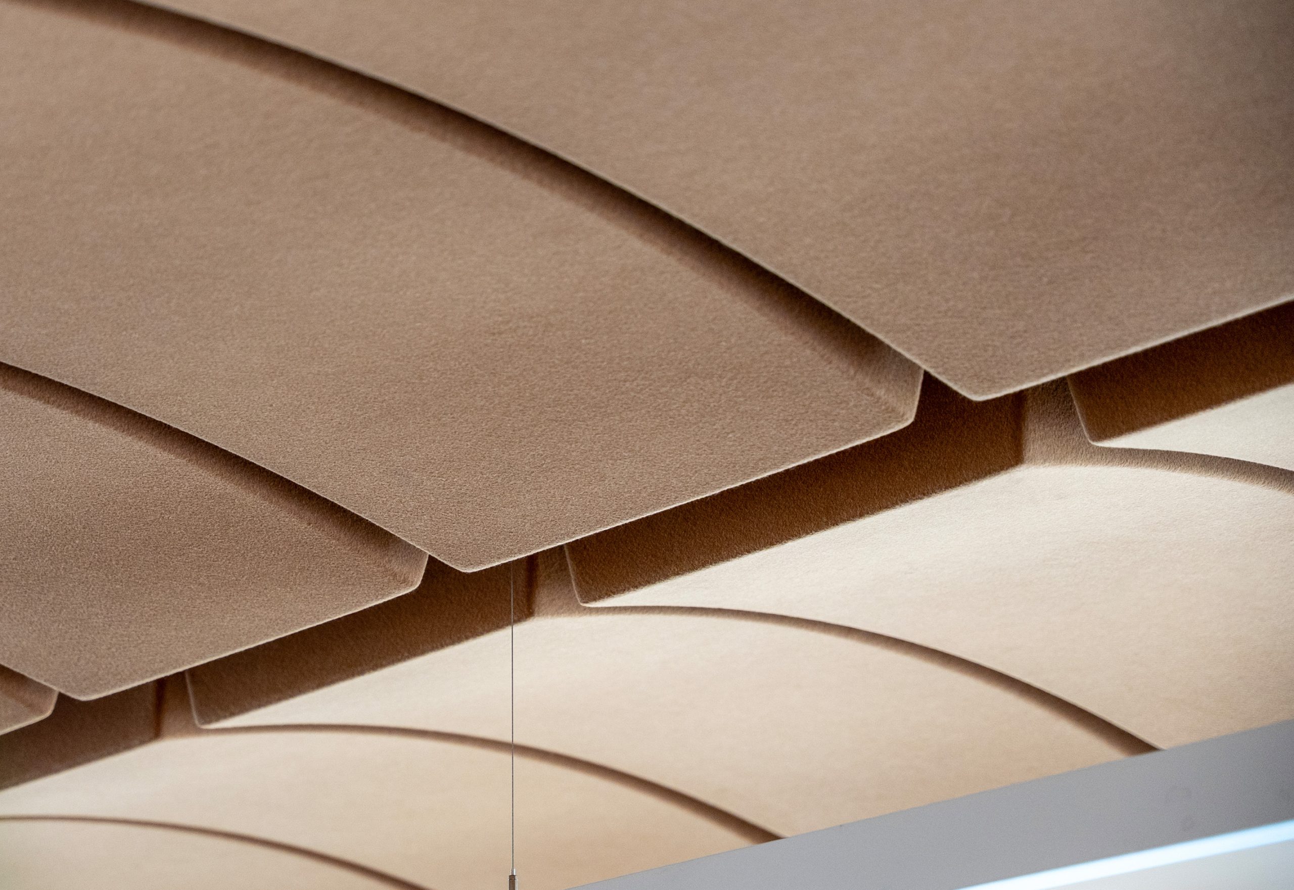 Volta acoustic ceiling panels with curved design