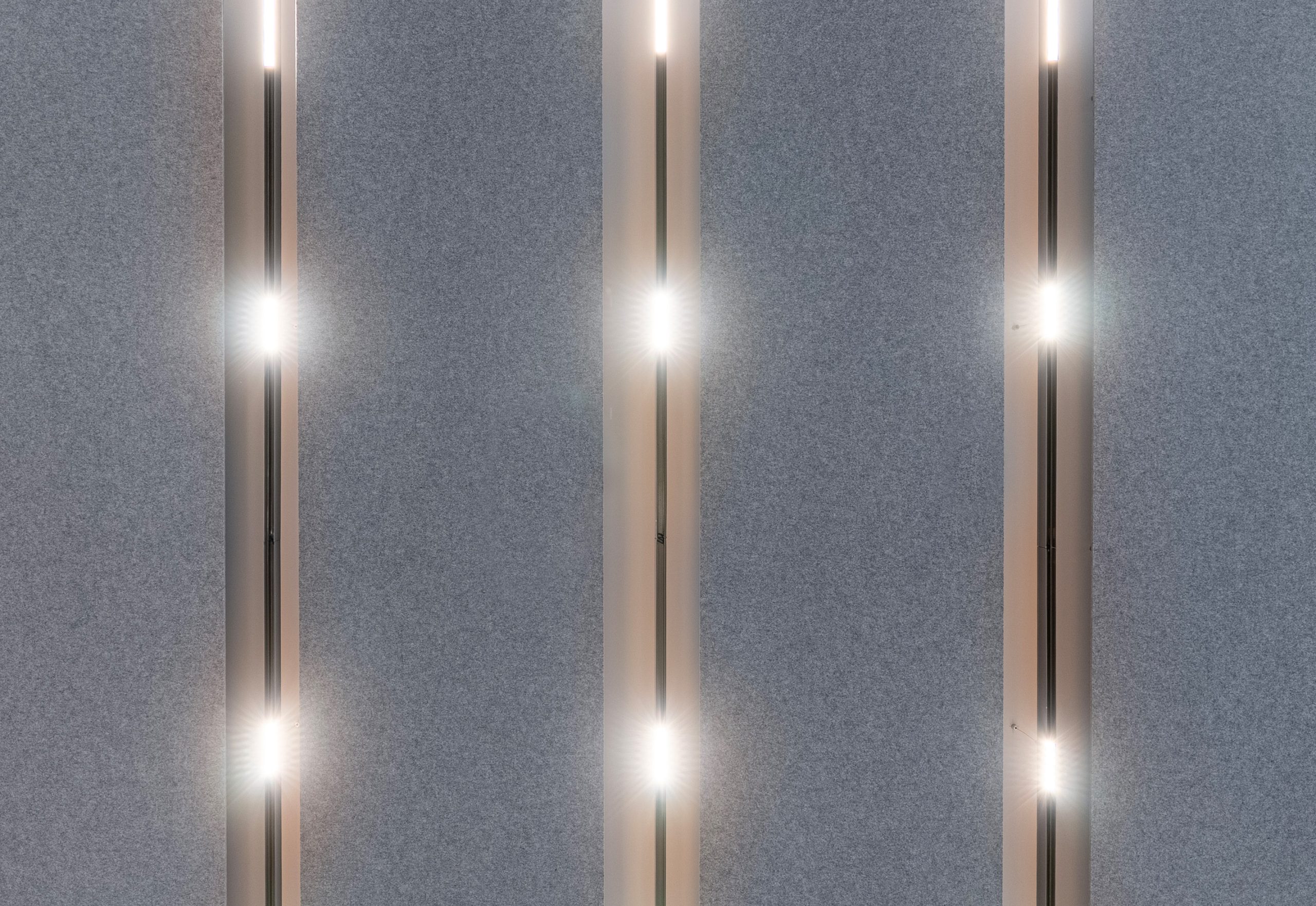 Flat Cloud acoustic ceiling panels with lighting at Nobel